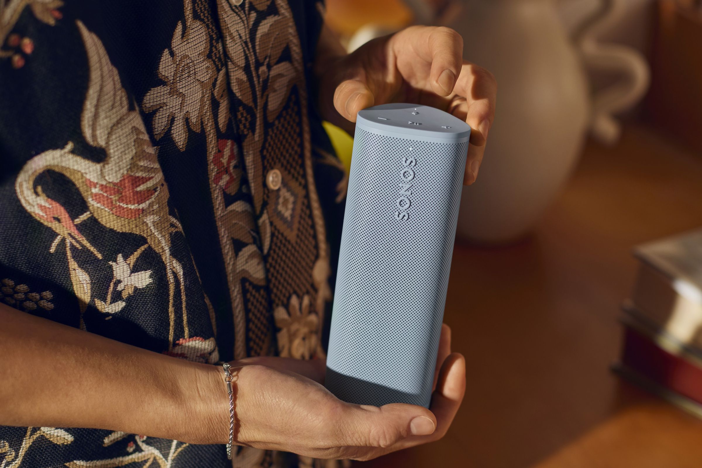 A marketing image of a blue Sonos Roam 2 speaker.