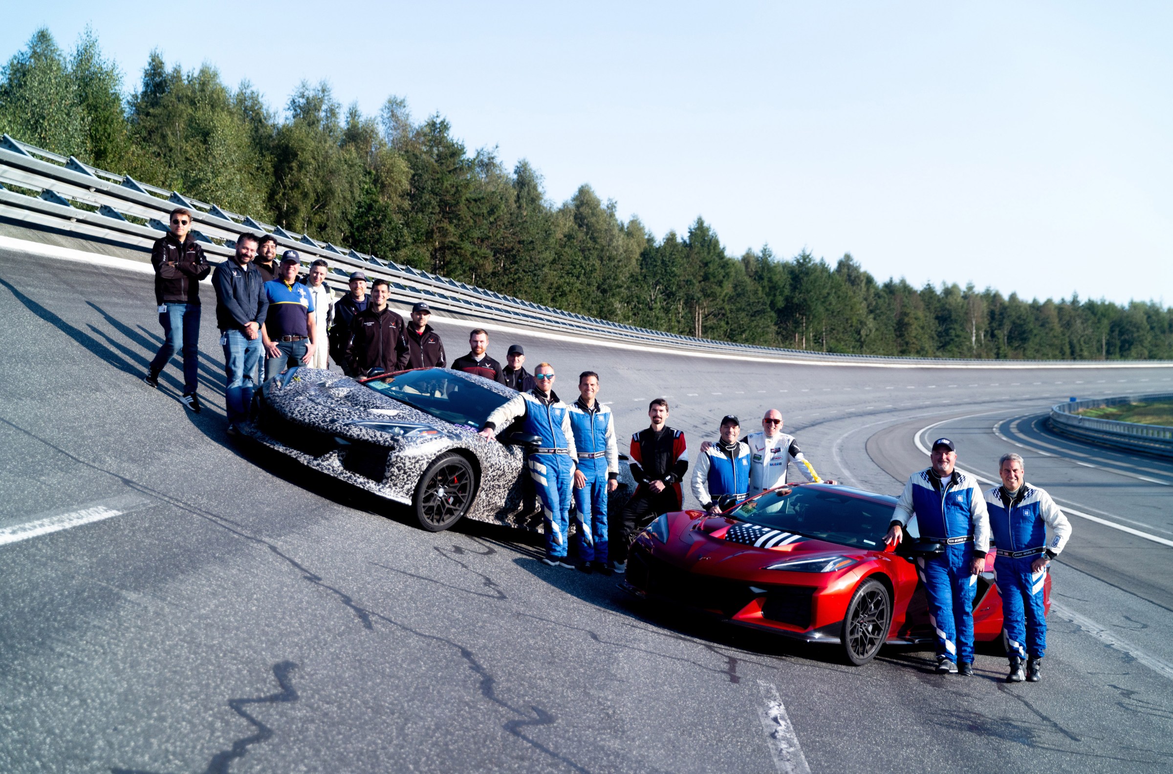 Members of the Corvette team, including General Motors President Mark Reuss on the track in Papenburg, Germany. Preproduction models shown. Actual production model may vary.
