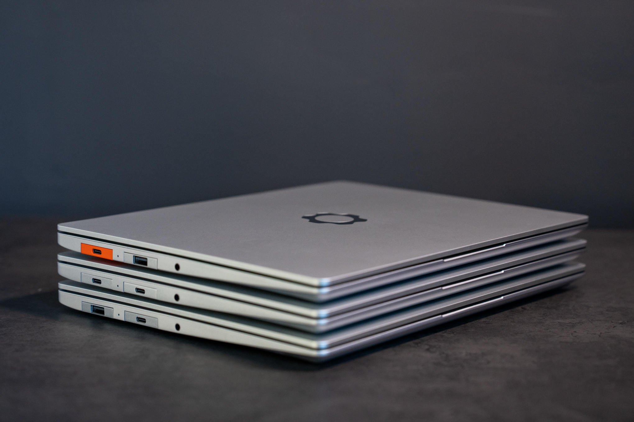 The new AMD Framework 13 atop the last-gen AMD and Intel models. If not for the orange USB-C port even I wouldn’t be able to tell them apart.