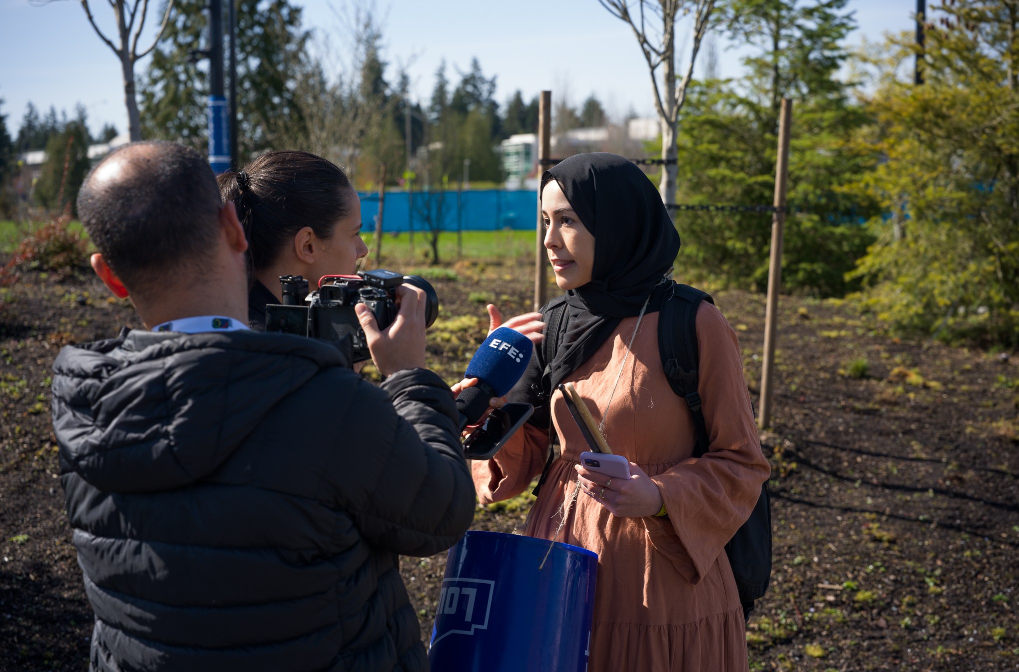 Microsoft employee Ibtihal Aboussad speaks to Agencia EFE reporters after being ushered out of the 50th anniversary event.