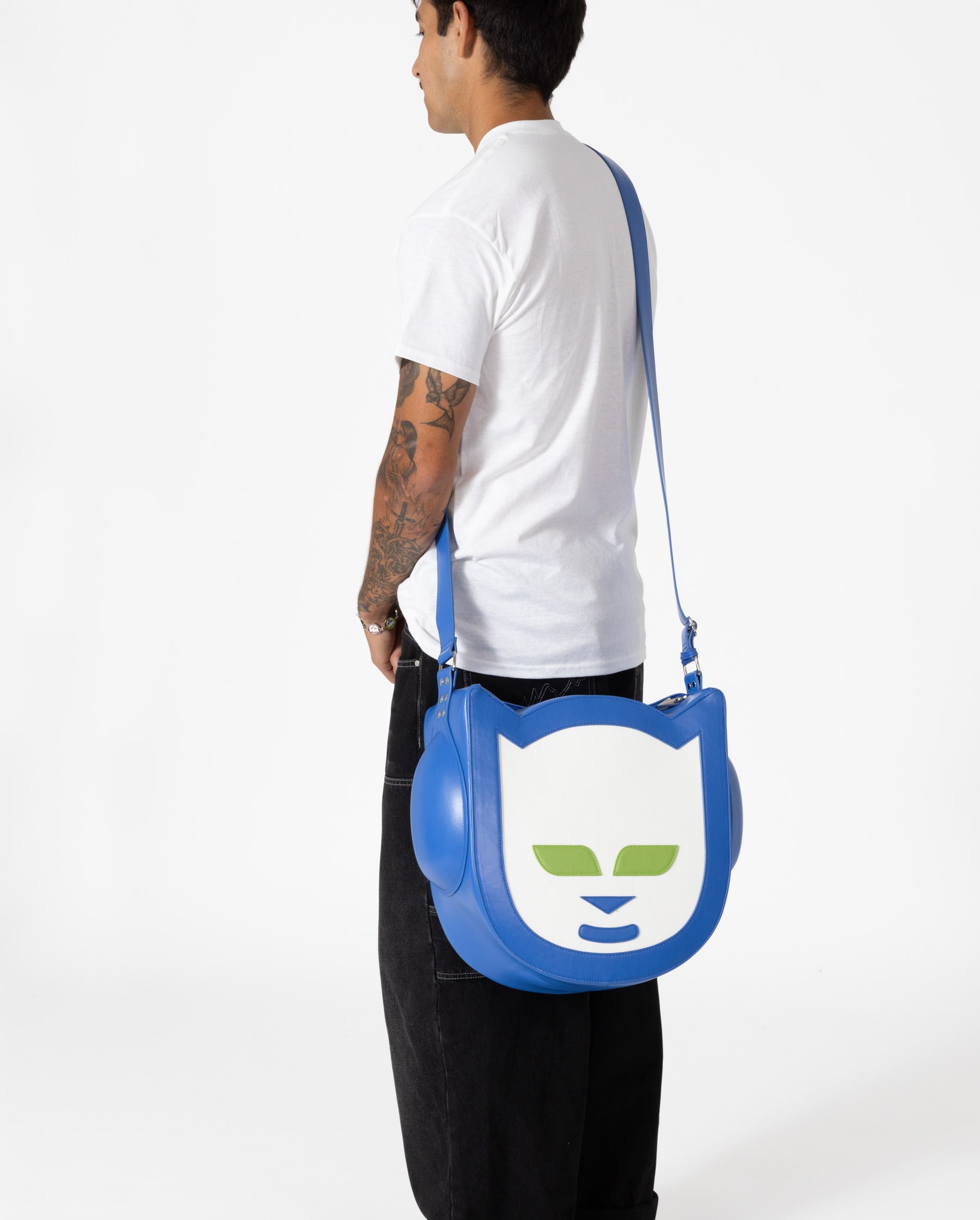 Image of a person wearing a bag in the shape of the Napster logo 