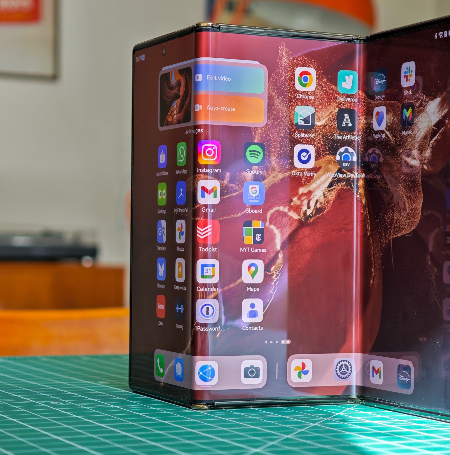 Huawei Mate XT standing open on a table
