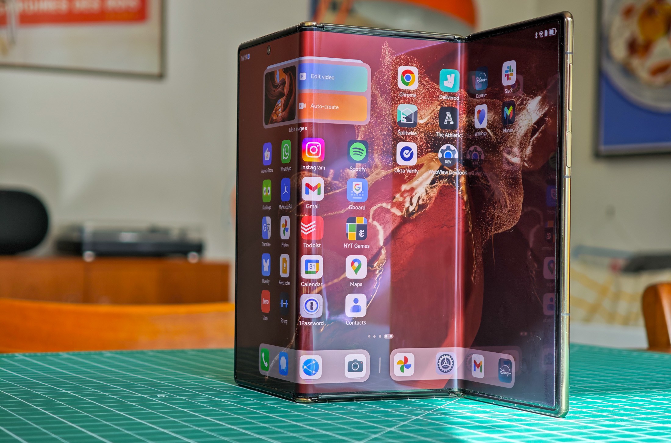 Huawei Mate XT standing open on a table
