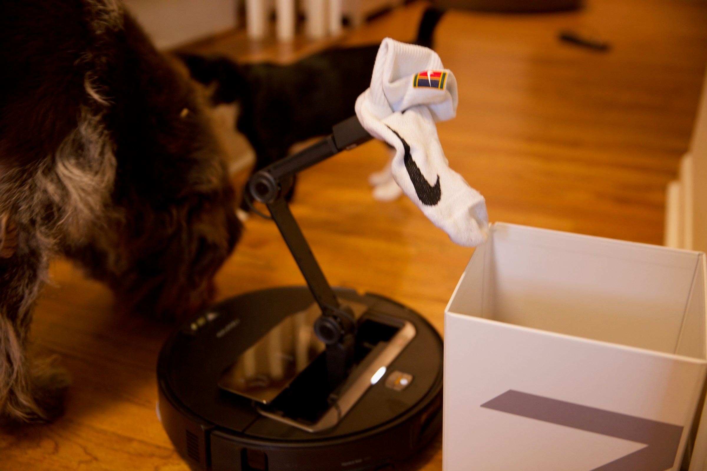The Z70 can take objects it picks up to designated areas, including this box Roborock supplies with the robot.