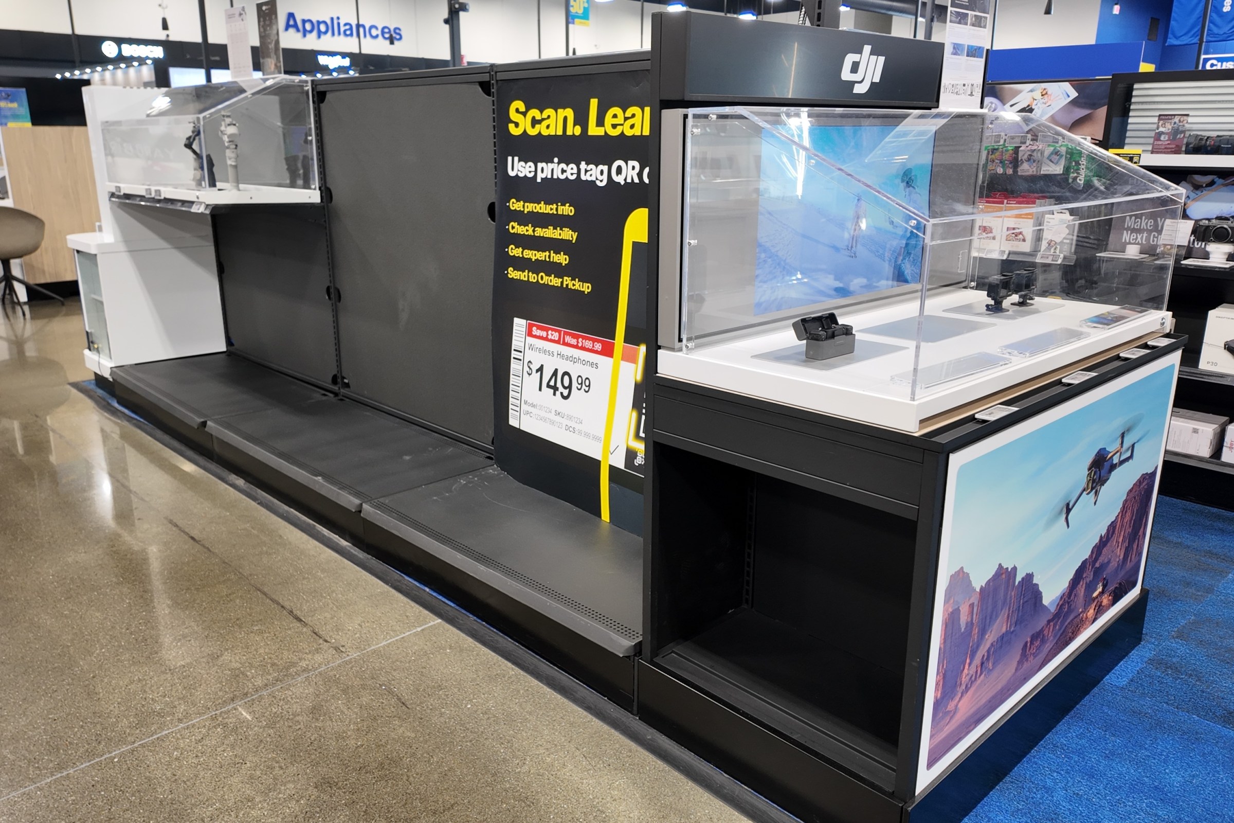 Empty shelves, missing price tags and lockers in the DJI section of Best Buy.