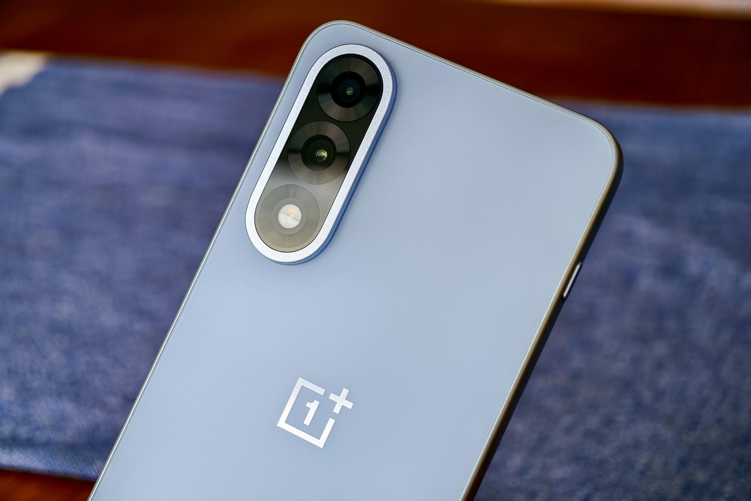 Photo of the OnePlus Nord 5 showing the cameras with light refracting off the lenses