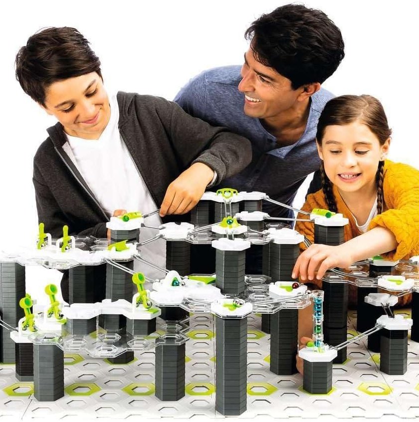 Man, woman, and child playing a board game.