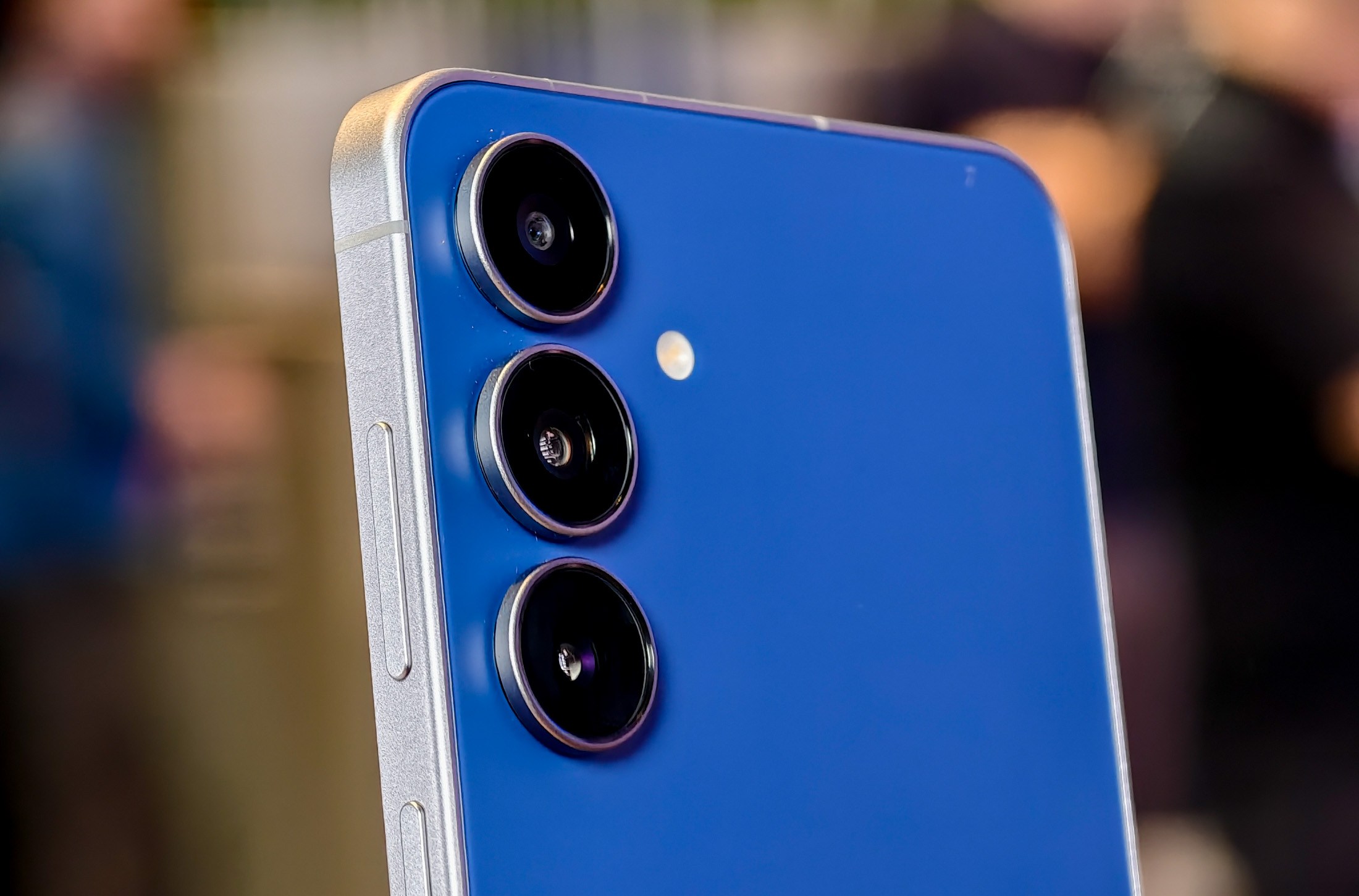 Samsung Galaxy S25 FE in navy blue from an angle showing the cameras