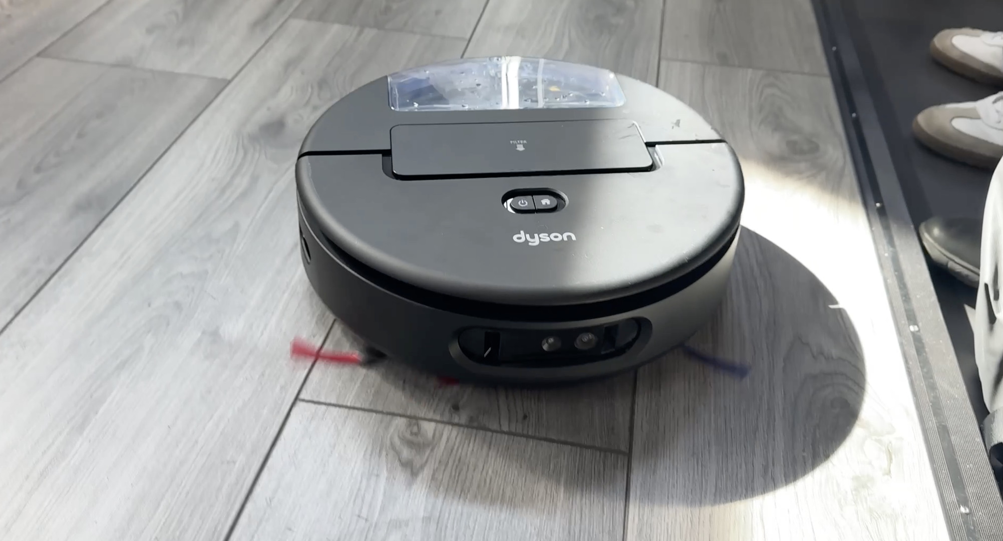 The Spot+Scrub uses lidar for navigation, but it doesn’t have a lidar tower on top. Its bin/filter is located in a compartment on the top. It has two physical buttons on top for control.