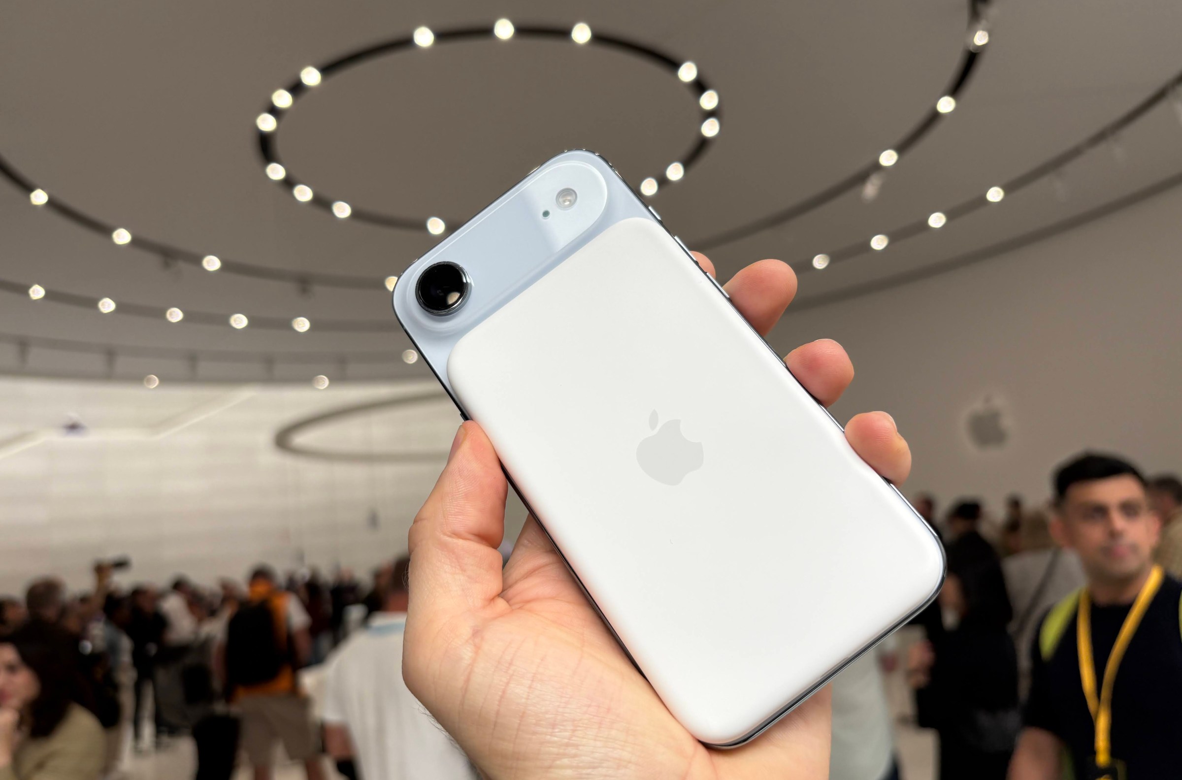 Hand holding the back of the iPhone Air