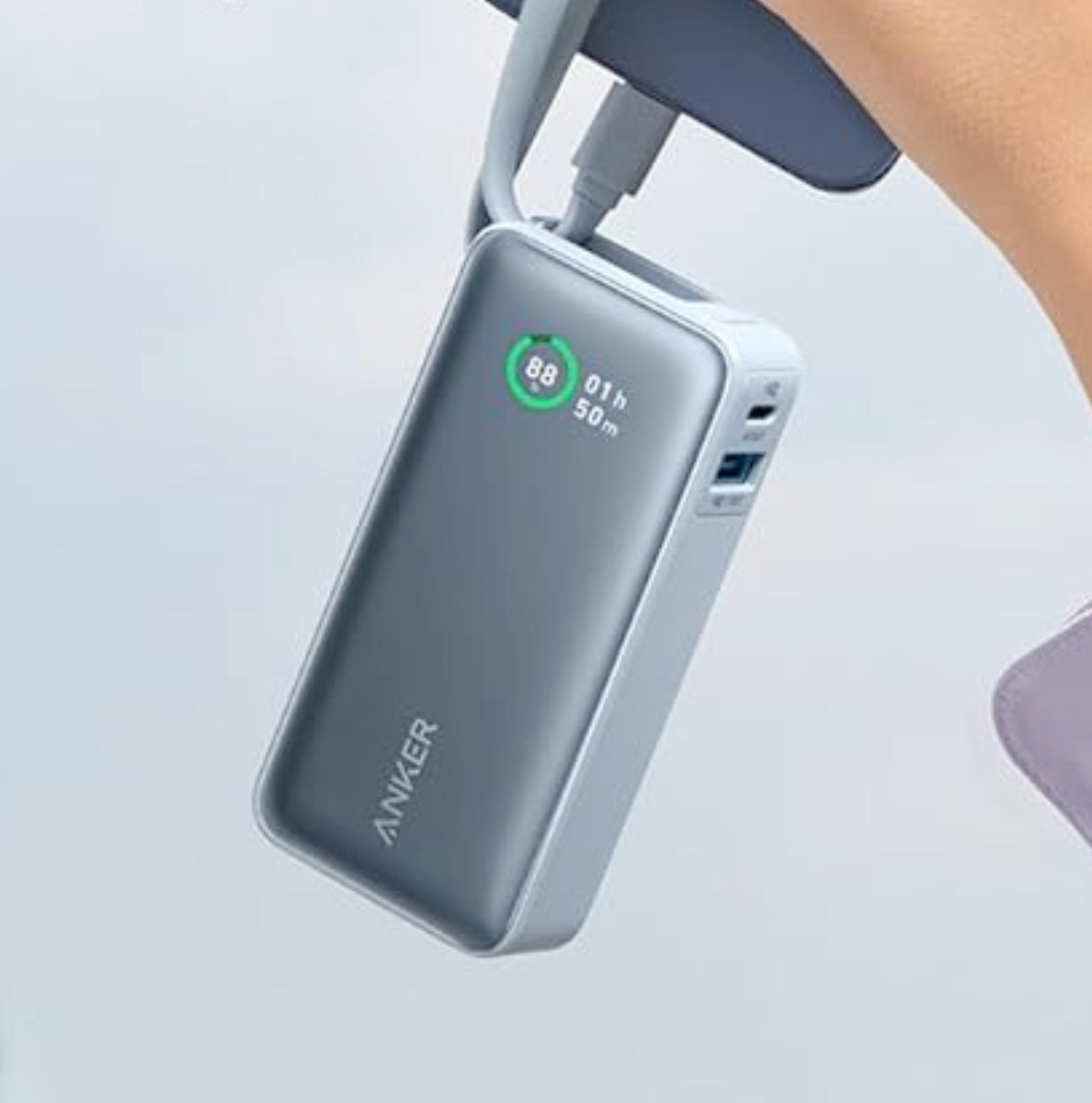 Anker's Nano Power Bank (10K, 2-Ports, Built-in USB-C cable) being held.